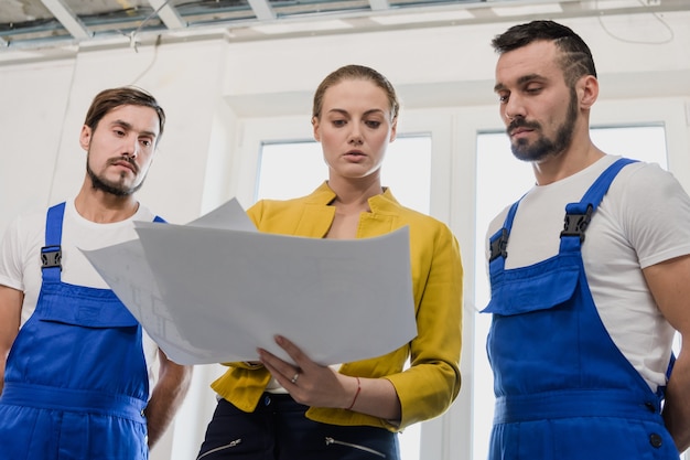 female customer discusses with contractor details house building 225094 547